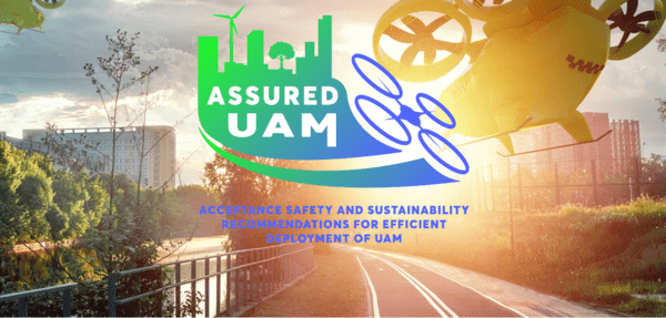 Image of drones in a city with the ASSURED-UAM logo in the foreground