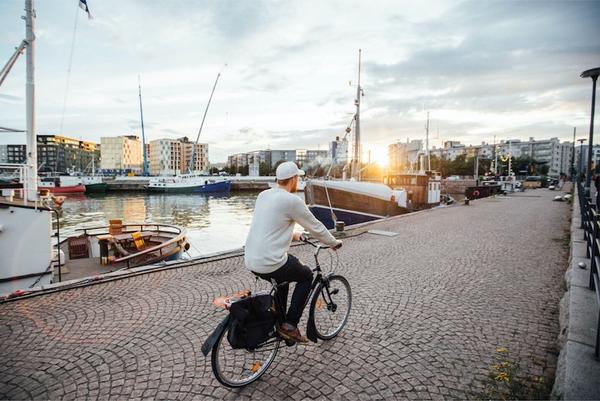 Man cycling along Helsinki port