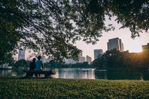 couple sitting by a lake