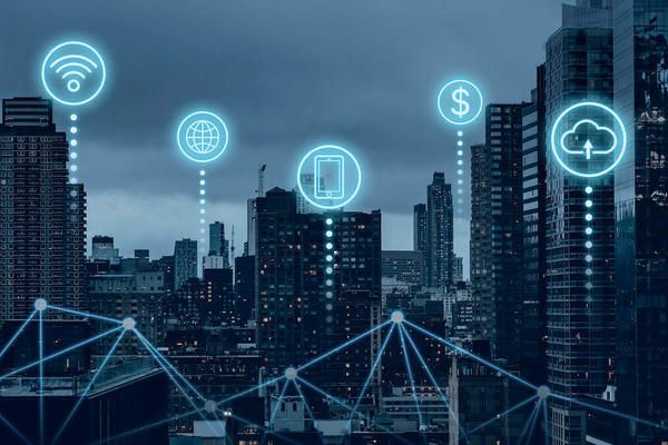 Cityscape with 2D digital icons in the sky representing the use of data in cities