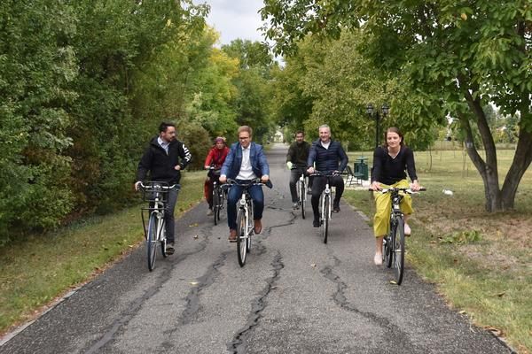 Six people cycling on a bike path in Hungary