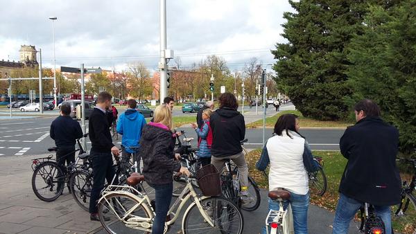 Participants (with their backs to the camera) with bicycles on a study tour in Czechia