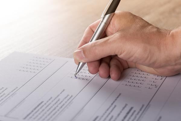 Generic photo of person filling in a survey