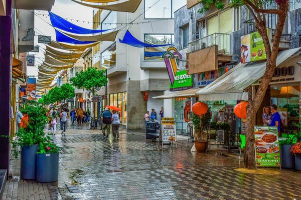 People walking along a large pedestrian street