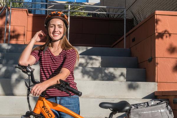 Woman standing with her bike