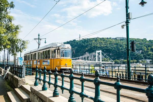 Tram in Budapest with the cityscape in the background