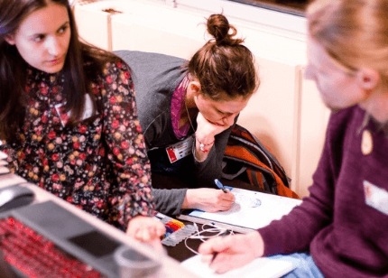 Three young people working collaboratively
