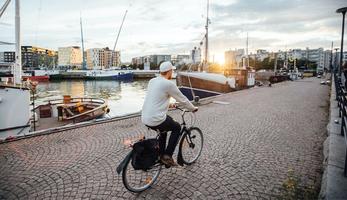 Man cycling along Helsinki port