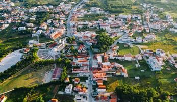 Aerial view of a small city in Bosnia surrounding by greenery