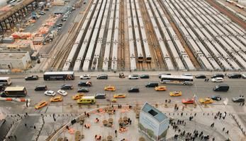 Cars and trucks on a busy street from aerial perspective