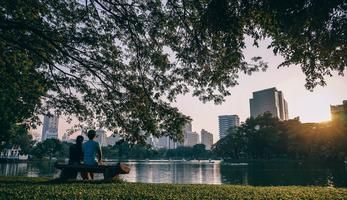 couple sitting by a lake