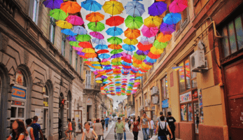 A street in Bucharest filled with pedestrians and cyclists