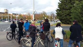 Participants (with their backs to the camera) with bicycles on a study tour in Czechia
