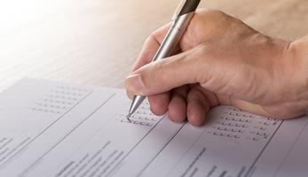 Generic photo of person filling in a survey