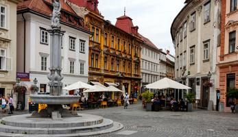 Ljubljana central square, with people sitting at outdoor tables