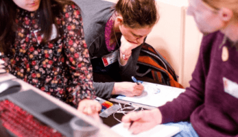 Three young people working collaboratively